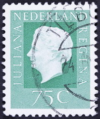 Stamp printed in Netherlands shows portrait of Queen.