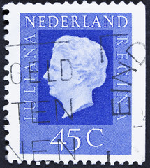 Stamp printed in Netherlands shows portrait of Queen.