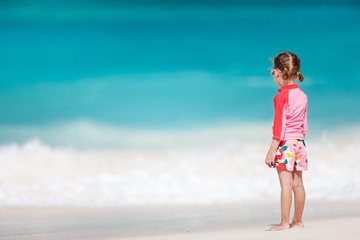 Fototapeta na wymiar Little girl at tropical beach