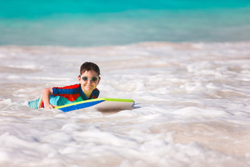 Boy swimming on boogie board