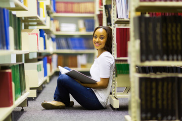 african college girl sitting in library