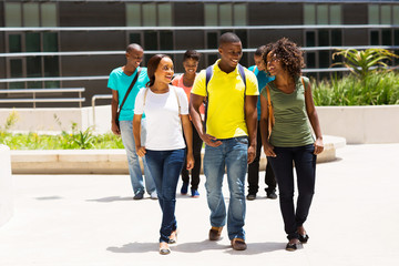 group of african american college students walking on campus