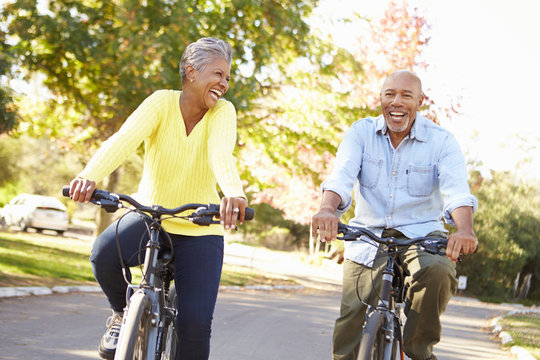 Senior Couple On Cycle Ride In Countryside