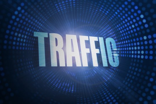 Traffic against futuristic dotted blue and black background