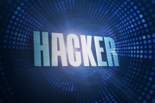 Hacker against futuristic dotted blue and black background