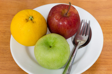 Healthy fruits like oranges and apples
