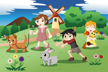 Obraz na płótnie Canvas Little kids with pets in the garden