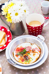 asian style fried egg in pan dish and coffee
