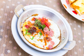 asian style fried egg in pan dish