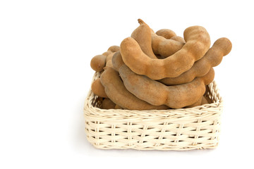 Tamarind in basket isolated on white background