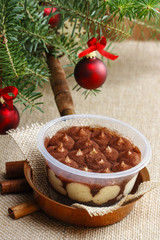 Tiramisu dessert on wooden table. Italian confectionery