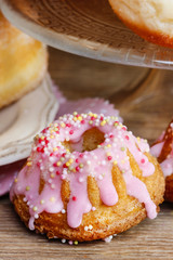 Easter yeast cake and donuts on wooden table. Traditional recipe