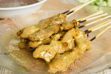 Grilled pork served with peanut sauce