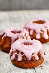 Traditional easter yeast cake decorated with pink icing