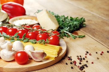 Pasta ingredients on the wooden table