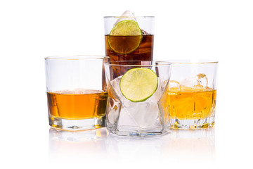 Selection of whiskey on ice over white background