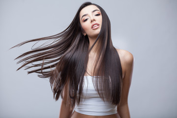 Beautiful Brunette Girl with Healthy Long Hair