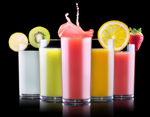 tasty summer fruit drinks in glass with splash
