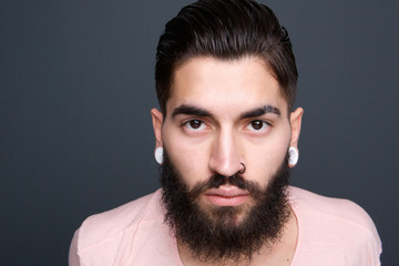 Young guy with beard and piercing