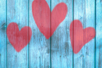 Love symbol on old wooden wall