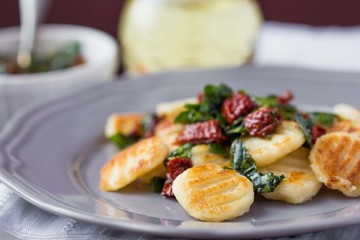 Fried potato gnocchi with sauce of dried tomatoes, spinach