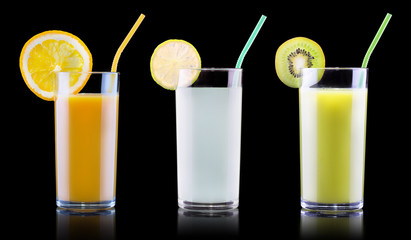 tasty summer fruits with juice in glass