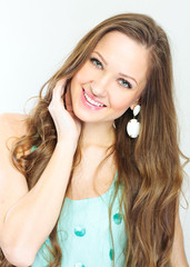 Obraz premium closeup portrait of a beautiful young woman with curly long hair