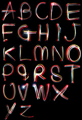 alphabet light neon writing long exposure - obrazy, fototapety, plakaty