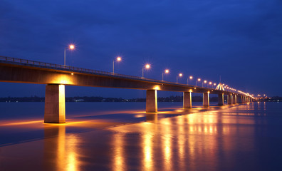 Fototapeta na wymiar concrete bridge and river in twilight