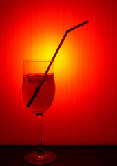 Hot summer drink - iced cocktail etc with straw. Red.