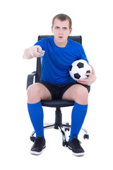 shocked man in uniform with remote control watching soccer game