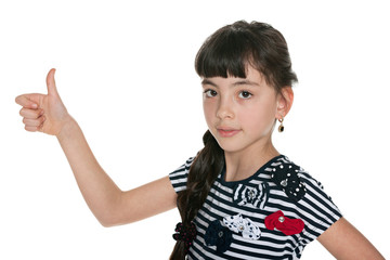 Young girl holding her thumb up