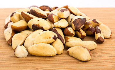 A close-up of Brazil nuts on a white background