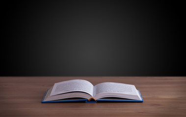 Open book on wooden deck