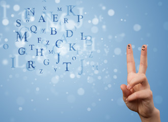 Happy smiley fingers looking at mixture of bokeh letters