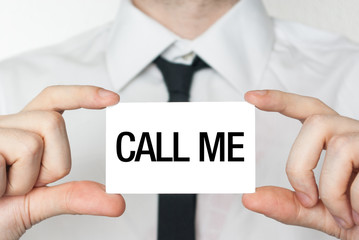 Call me. Businessman in white shirt with a black tie showing or