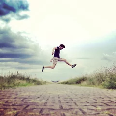Foto op Canvas man jumping © christianmutter