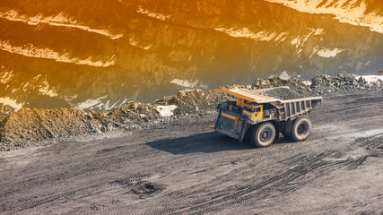 Dump Truck on the Road in a Open-Pit. Pit Dumper Truck Quarry Mining Iron Road 
