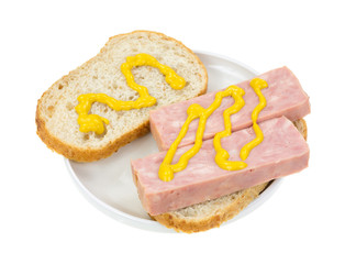 Obraz na płótnie Canvas Canned ham sandwich with mustard