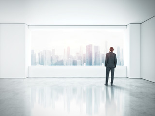 Fototapeta premium businessman standing in bright office