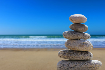 Fototapeta na wymiar zen balance stone on the beach 4