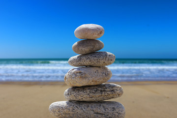zen balance stone on the beach 6