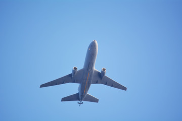 Fototapeta na wymiar Airplane against blue sky