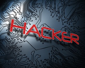 Hacker against illustration of circuit board