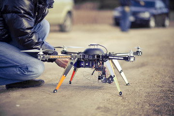 Quadrocopter drone ready to takeoff - 62384724