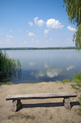 Empty bench on the lakeside