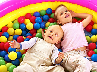 Fototapeta na wymiar Kids in colored ball.