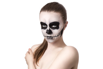 Portrait of young woman with skull make-up. Isolated on white.