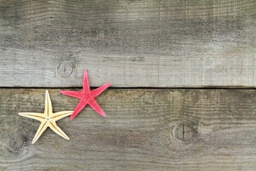 Starfishes on old plank