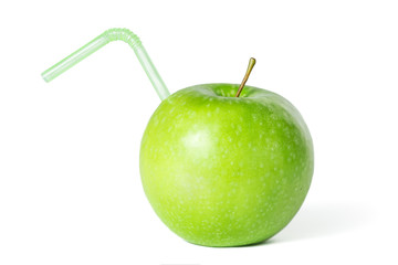 Green apple with a straw isolated on white.